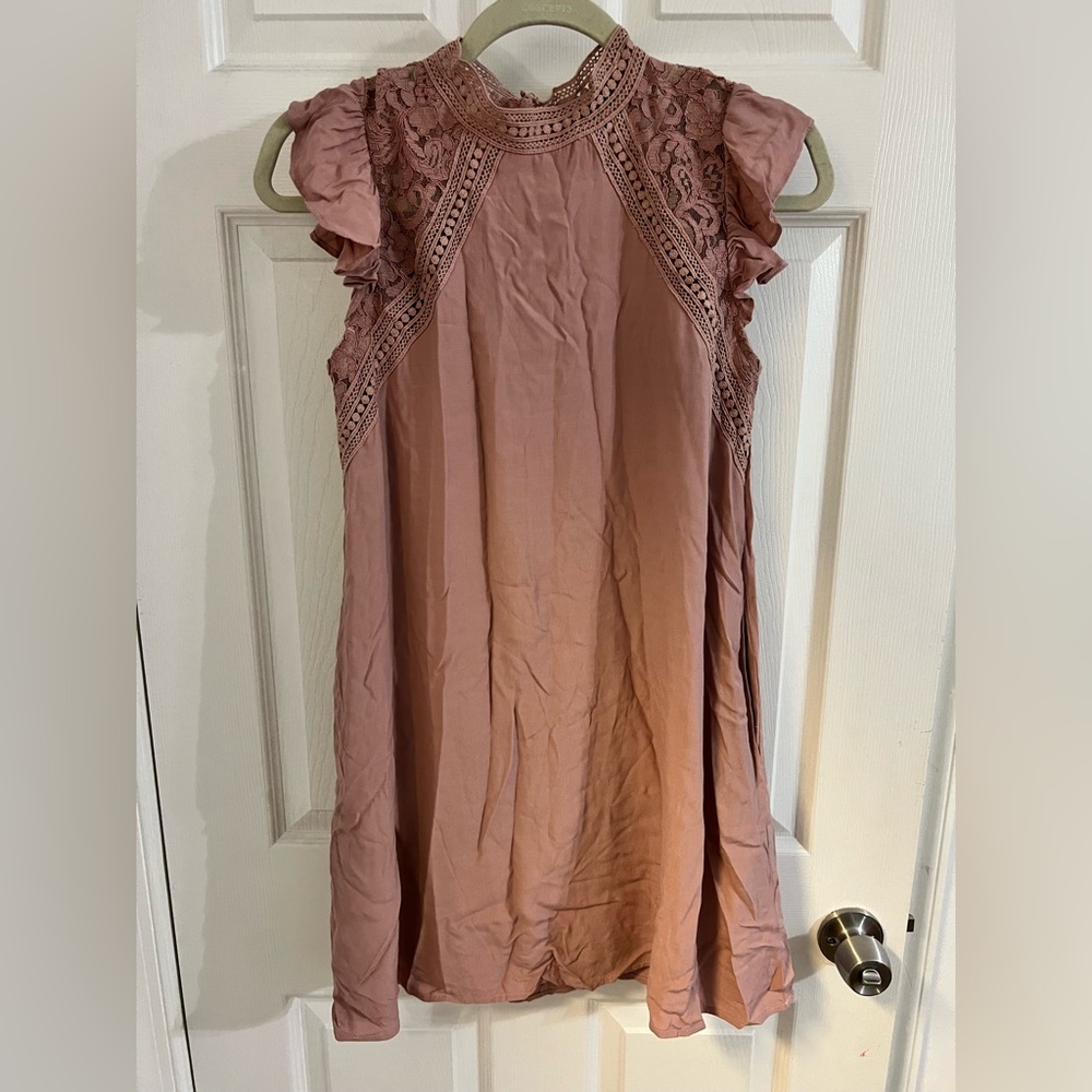 Mauve colored dress.